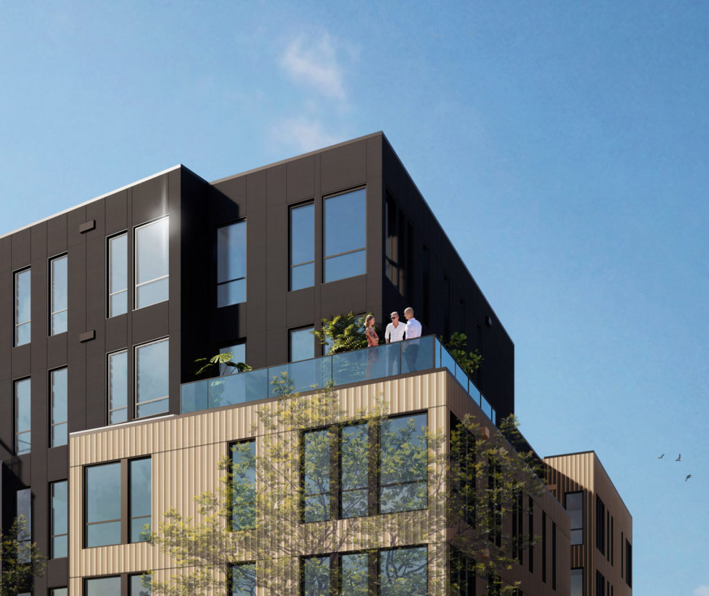 People standing on a balcony of The Hemlock building